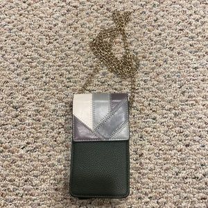 Crossbody bag for phone. Gold chain strap and wallet pockets on the back.